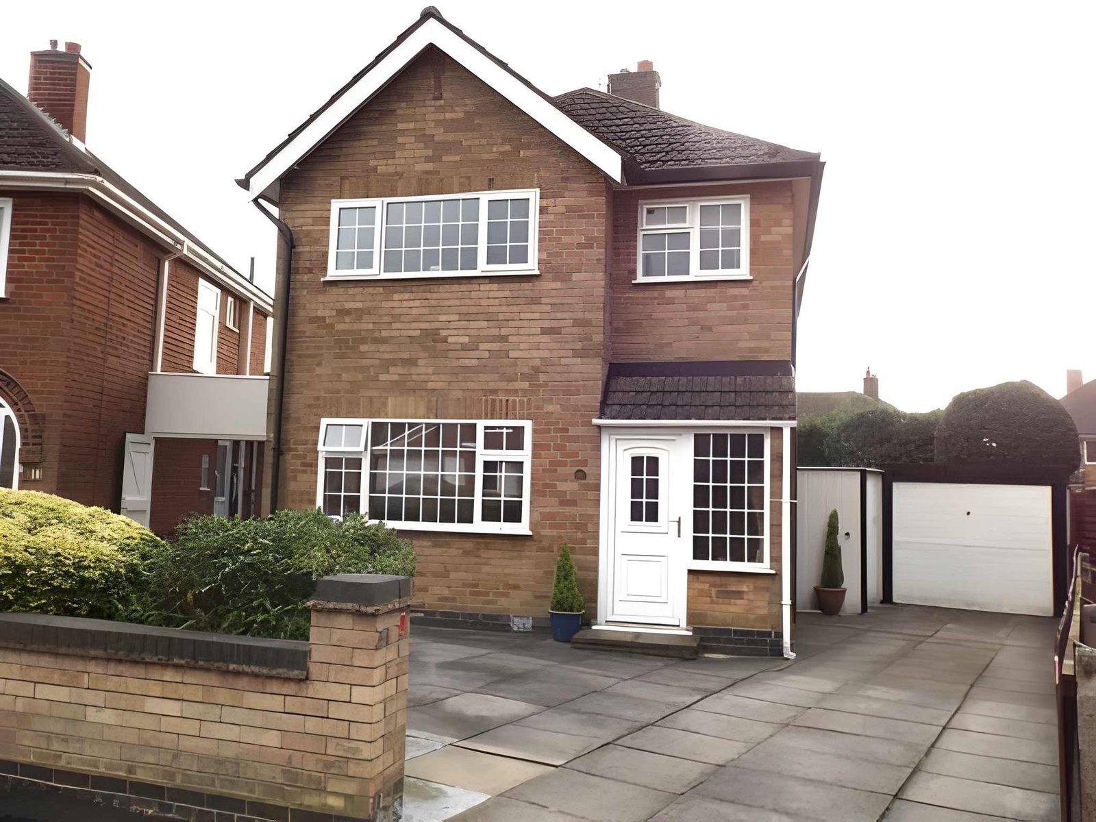 Front of the house with driveway and garage