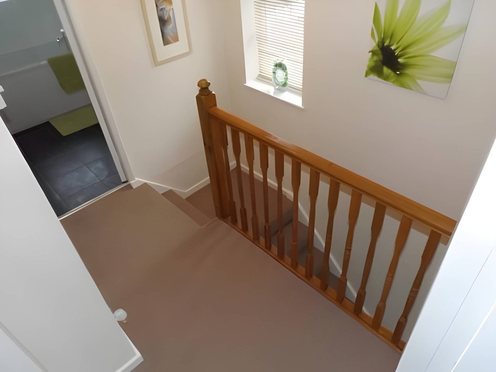 Landing with stairs and the bathroom door