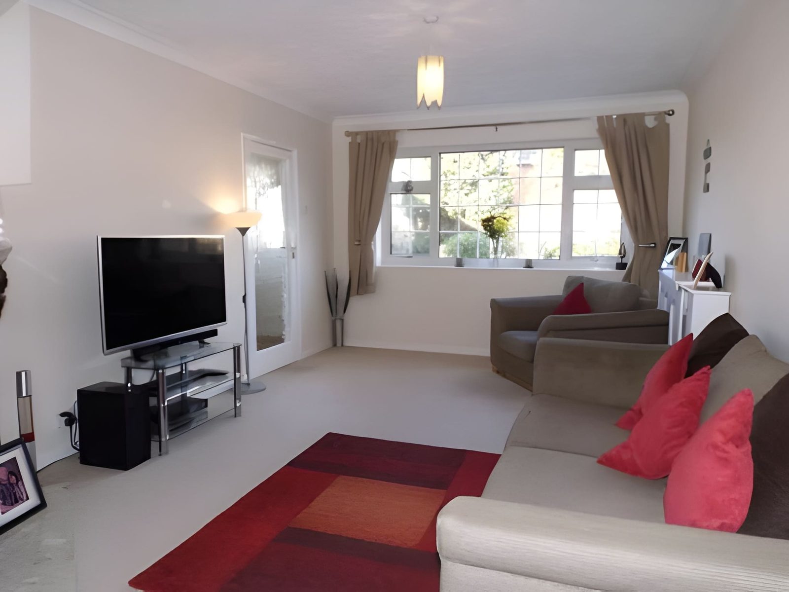 Lounge furnished, looking towards the front window