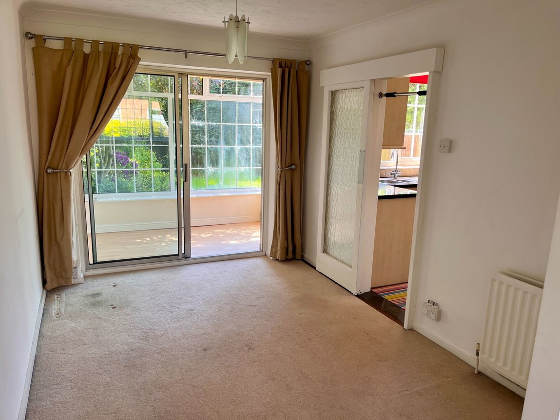 Dining room with sliding doors to the conservatory and door to the kitchen
